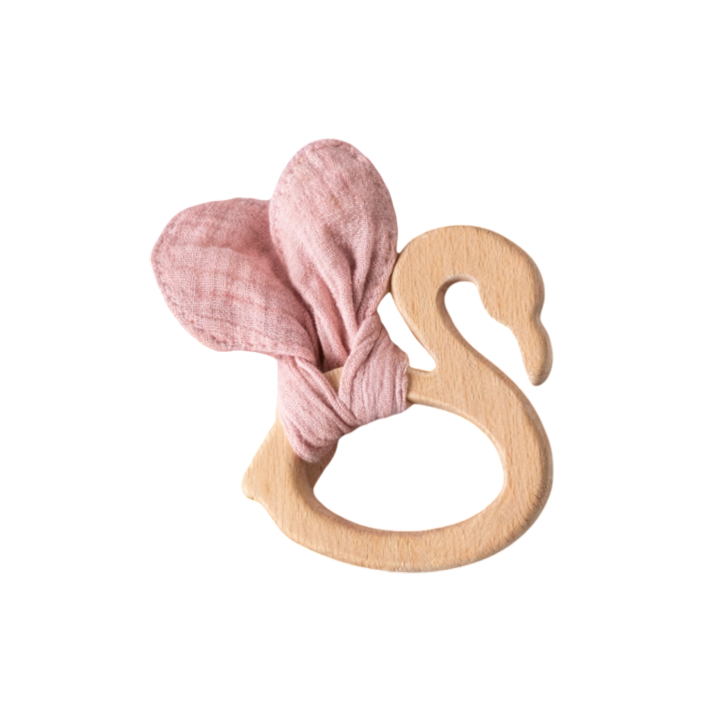 The Hello World "Swan Lake Diaper Cake" is a swan-shaped wooden teething ring with two soft pink fabric wings - ideal as a baby gift or birth gift - on a plain white background.