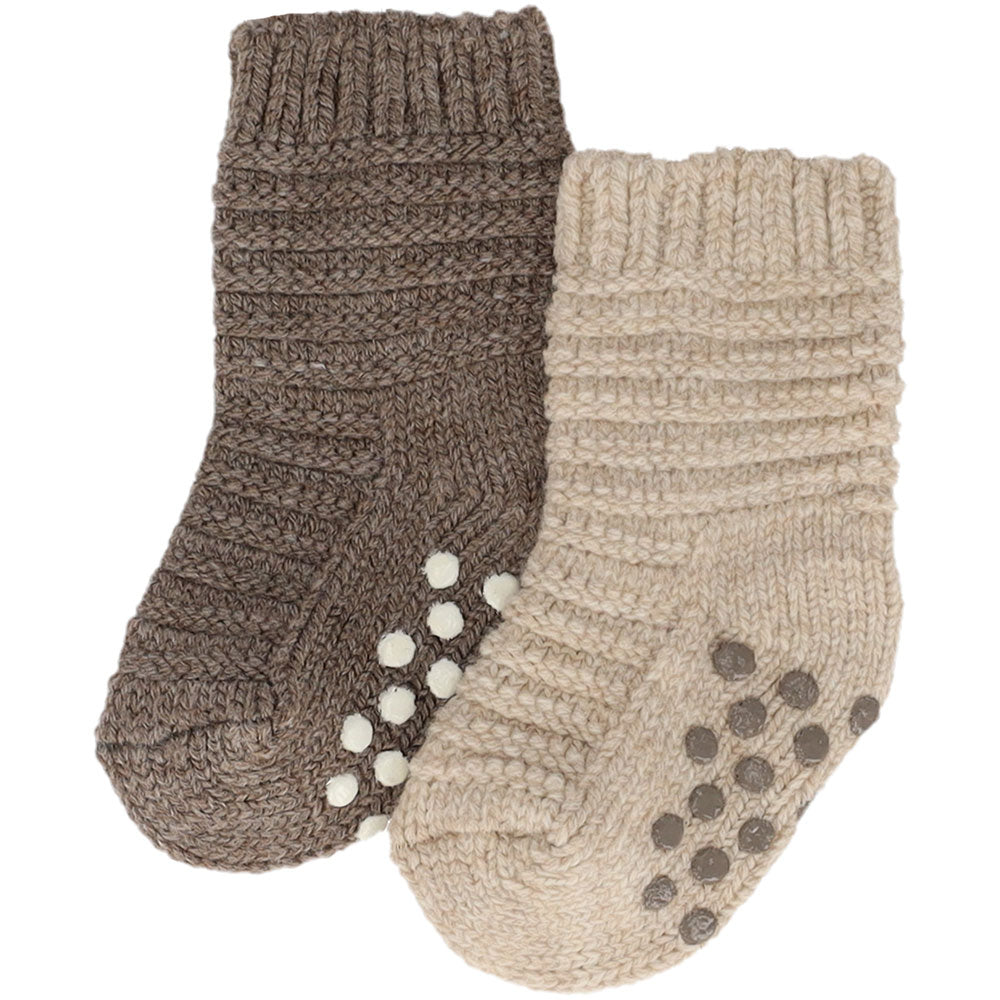 Calzini beige in maglia per bambini con gommini antiscivolo sulla suola