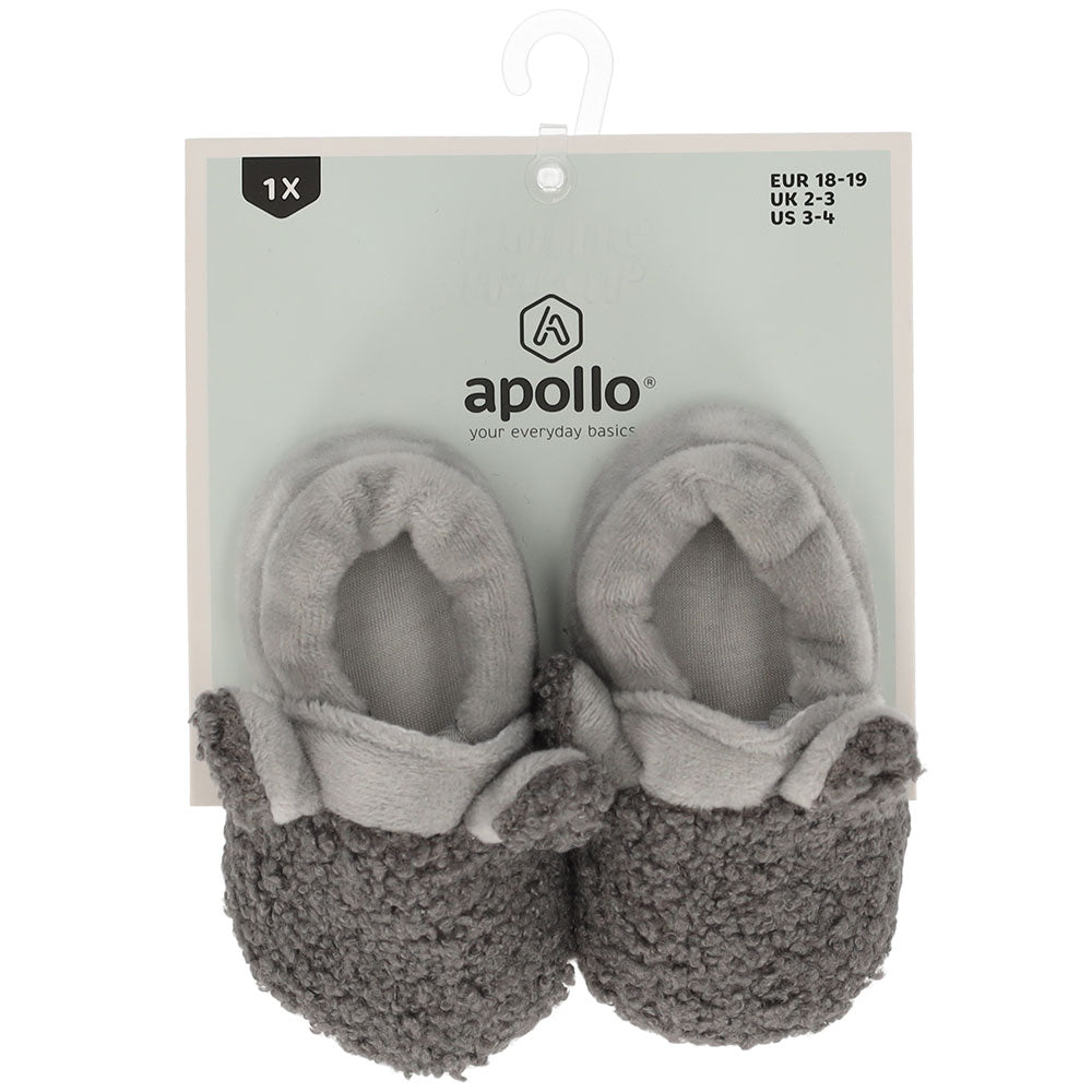 Peluche chaussures bébé grises d'Apollo sur l'emballage d'origine