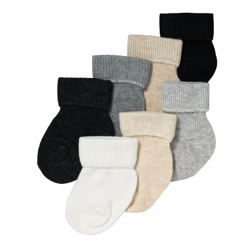 Seven baby socks made from 100 percent cotton in white, beige, gray and black