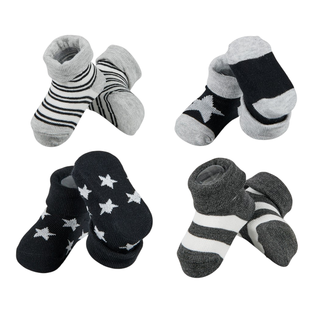 Four pairs of baby socks in black, gray and white with stars and stripes