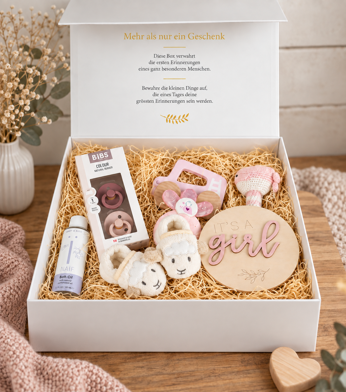 Open baby gift box Tiffany with baby shoes, whale rattle, BIBS pacifiers, pink cooling teether, push car and NAÏF bath oil