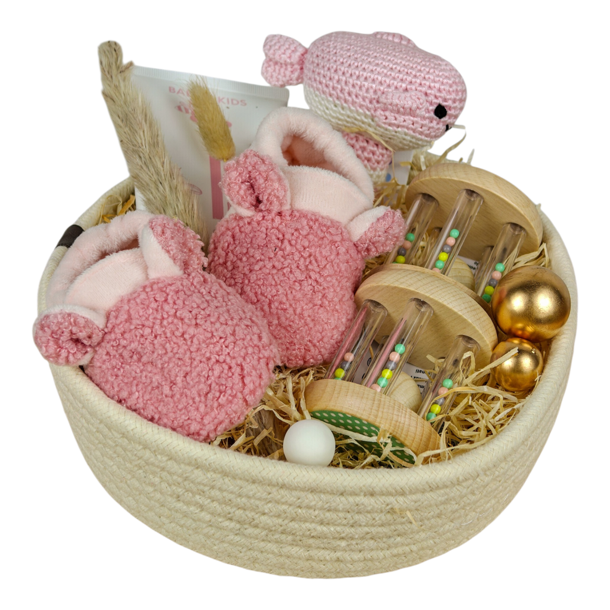 Fiona gift basket with pink baby rattle whale, baby shoes, grasping toys animals pastel and NAÏF body lotion in a white cotton basket