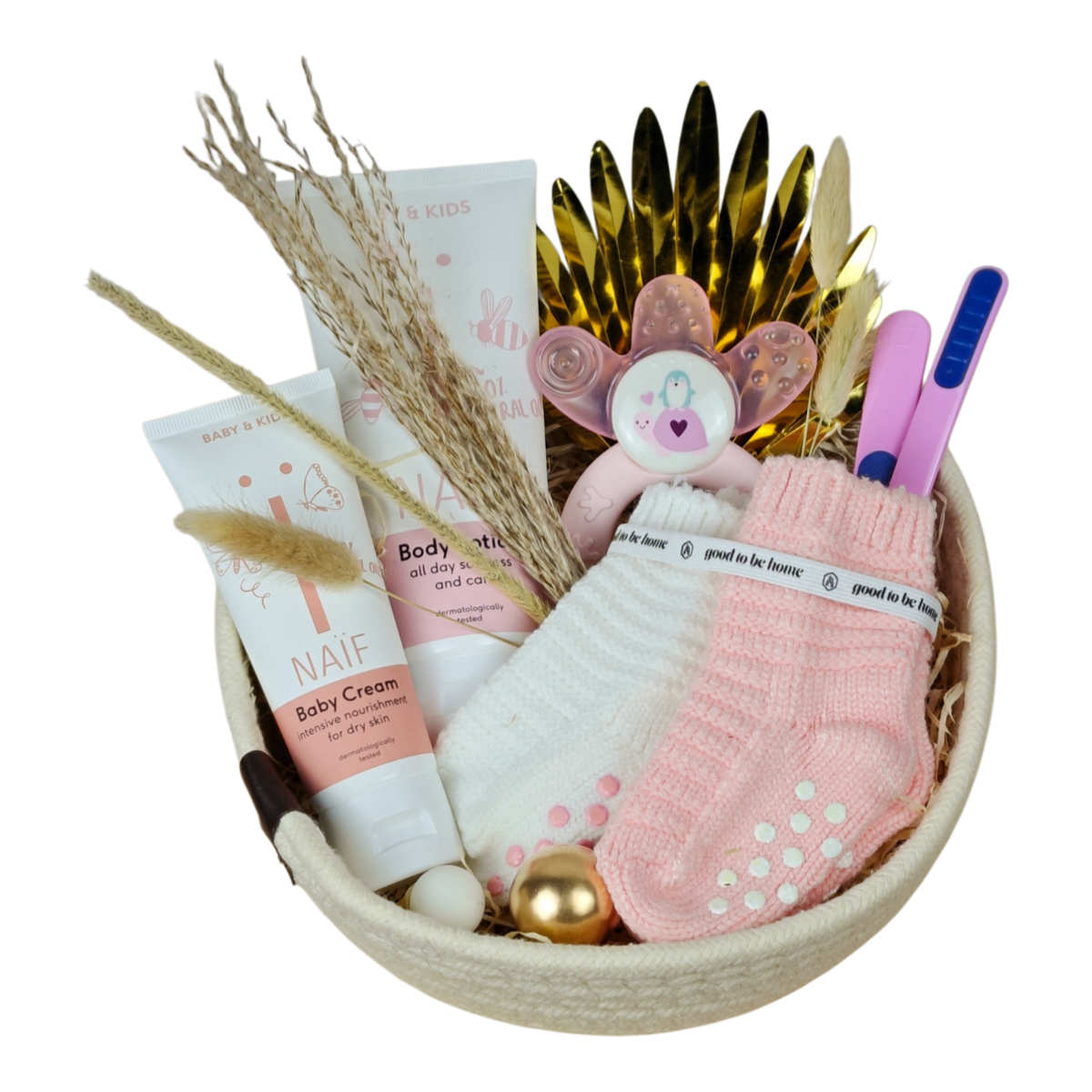 Baby gift basket Lisa in a white cotton basket with NAÏF care products, baby socks, learning spoons and cooling teething ring