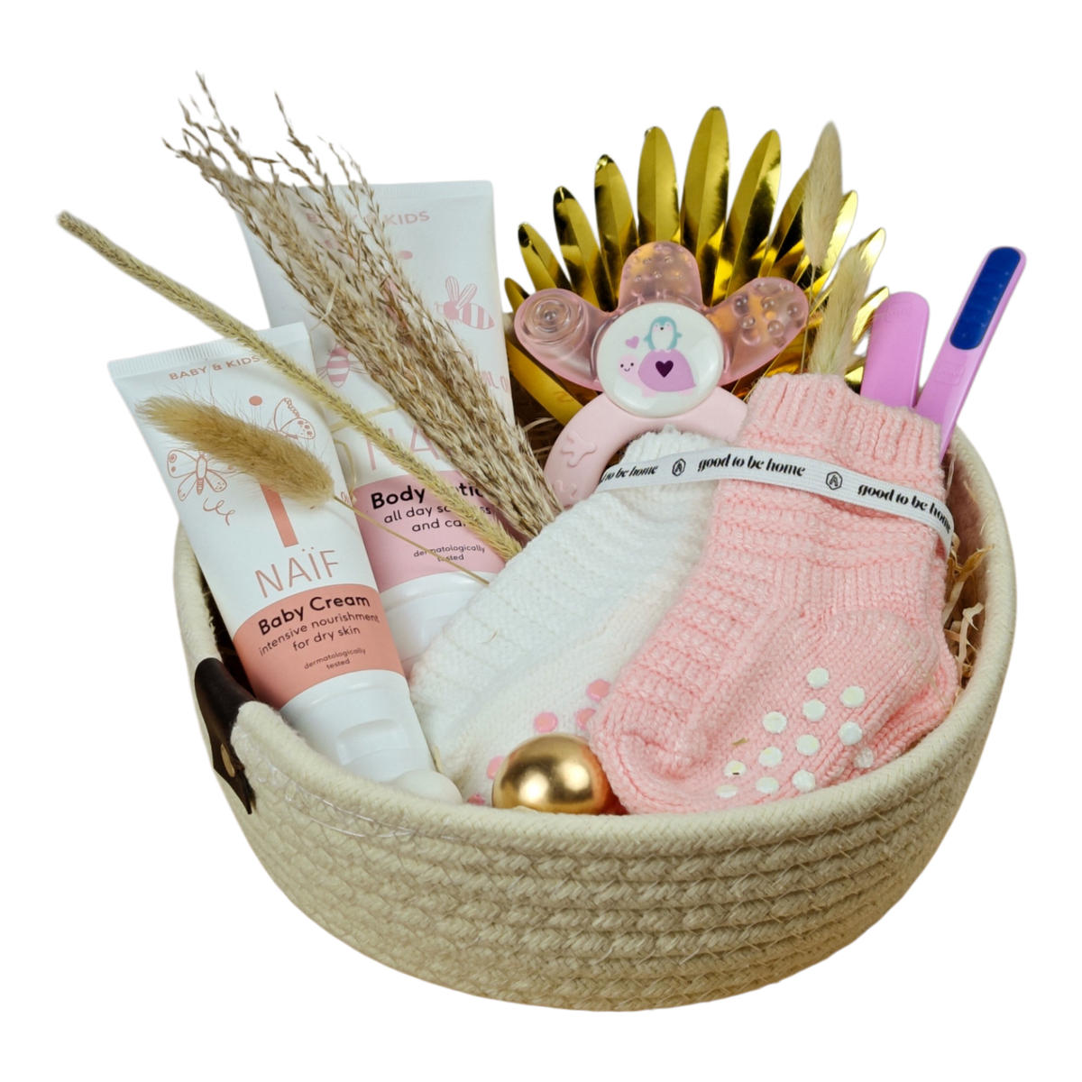 Lisa gift basket with baby socks in pink and white, pink learning spoon set, cooling teething ring and NAÏF body lotion and care cream