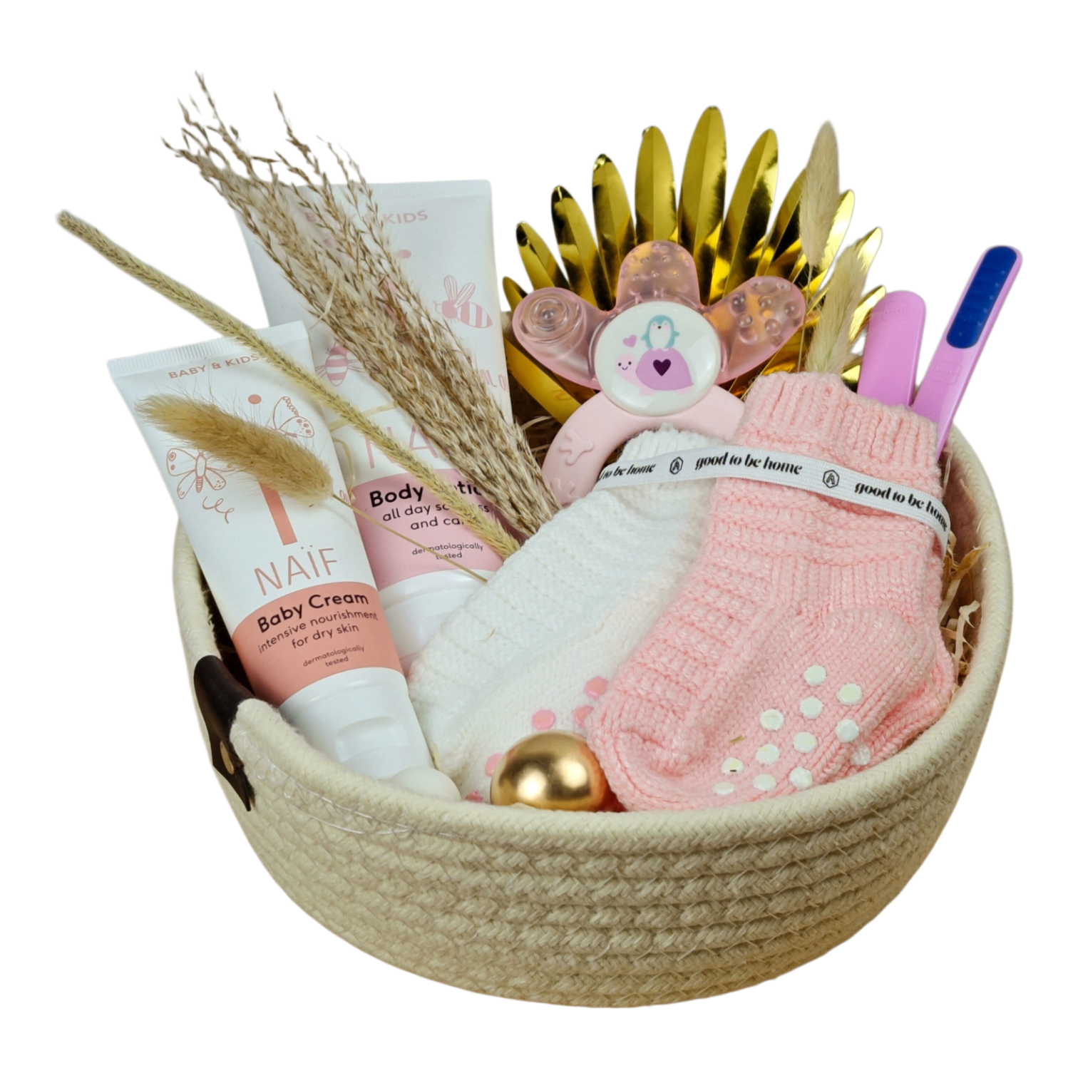 Lisa gift basket with baby socks in pink and white, pink learning spoon set, cooling teething ring and NAÏF body lotion and care cream