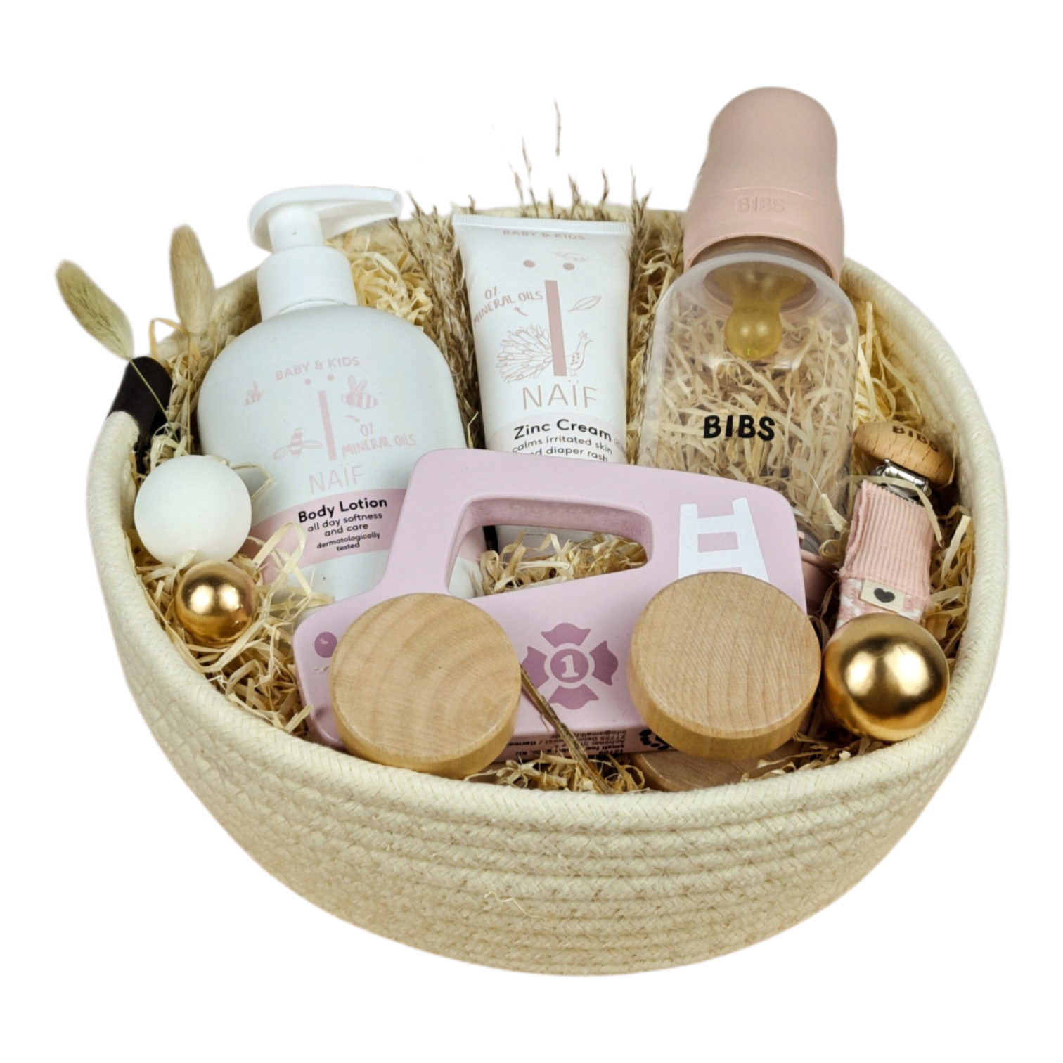 Livia gift basket with BIBS Rosé baby bottle, pacifier chain, NAÏF body lotion, diaper cream and pink wooden car