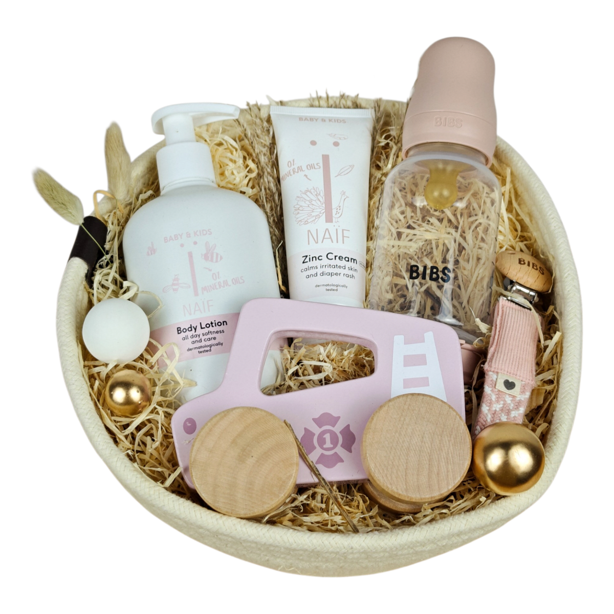Baby gift basket Livia in a white cotton basket with BIBS baby bottle, pacifier chain, NAÏF care products and pink push car