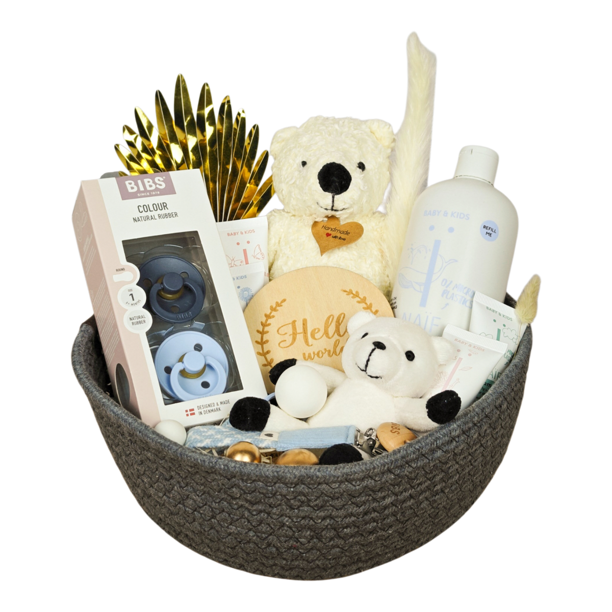 Nevio gift basket with BIBS pacifiers, NAÏF baby care, teddy bears, pacifier chain and baby accessories in blue and cream.