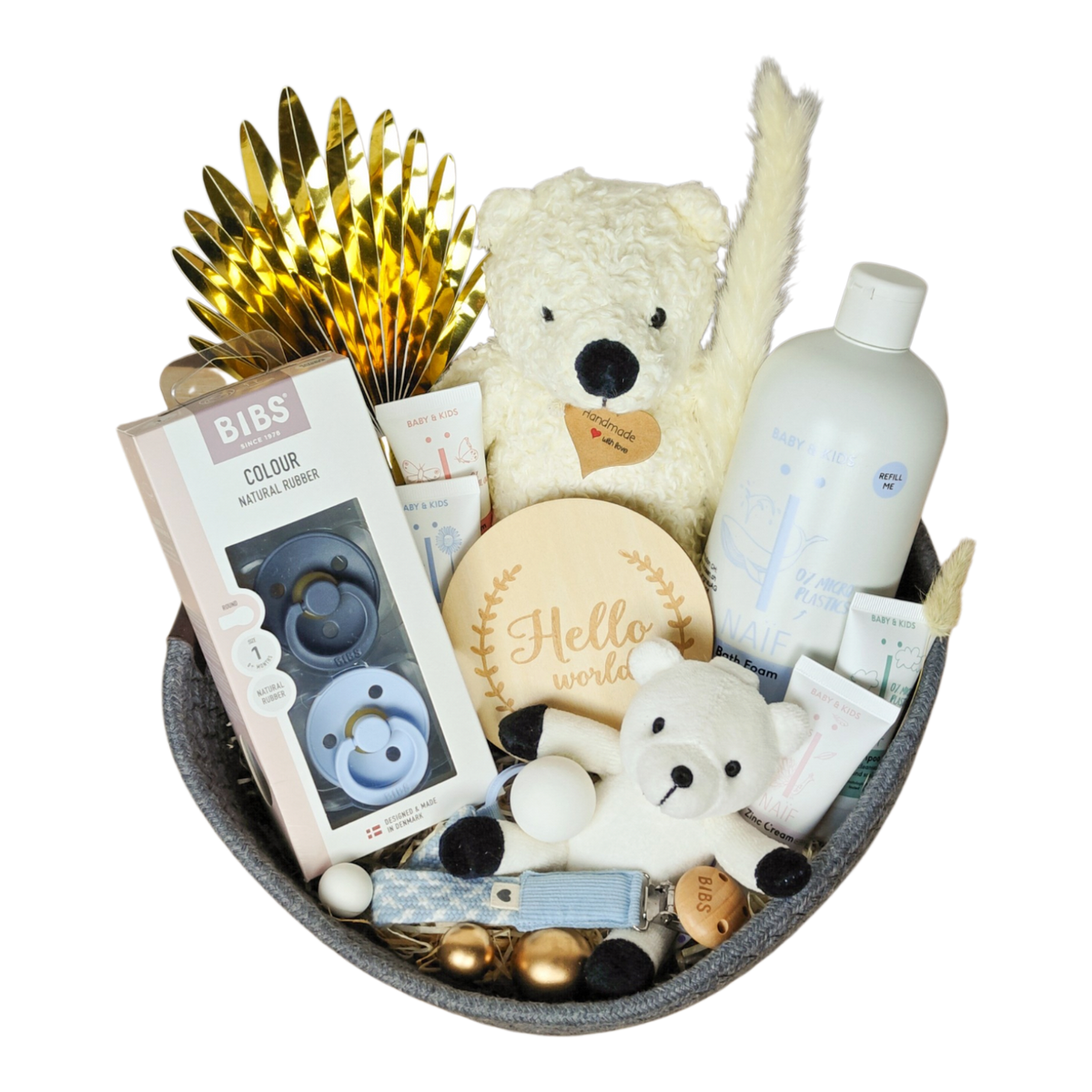 Nevio gift basket with BIBS pacifiers, NAÏF baby care, teddy bears, pacifier chain and baby accessories in blue and cream.