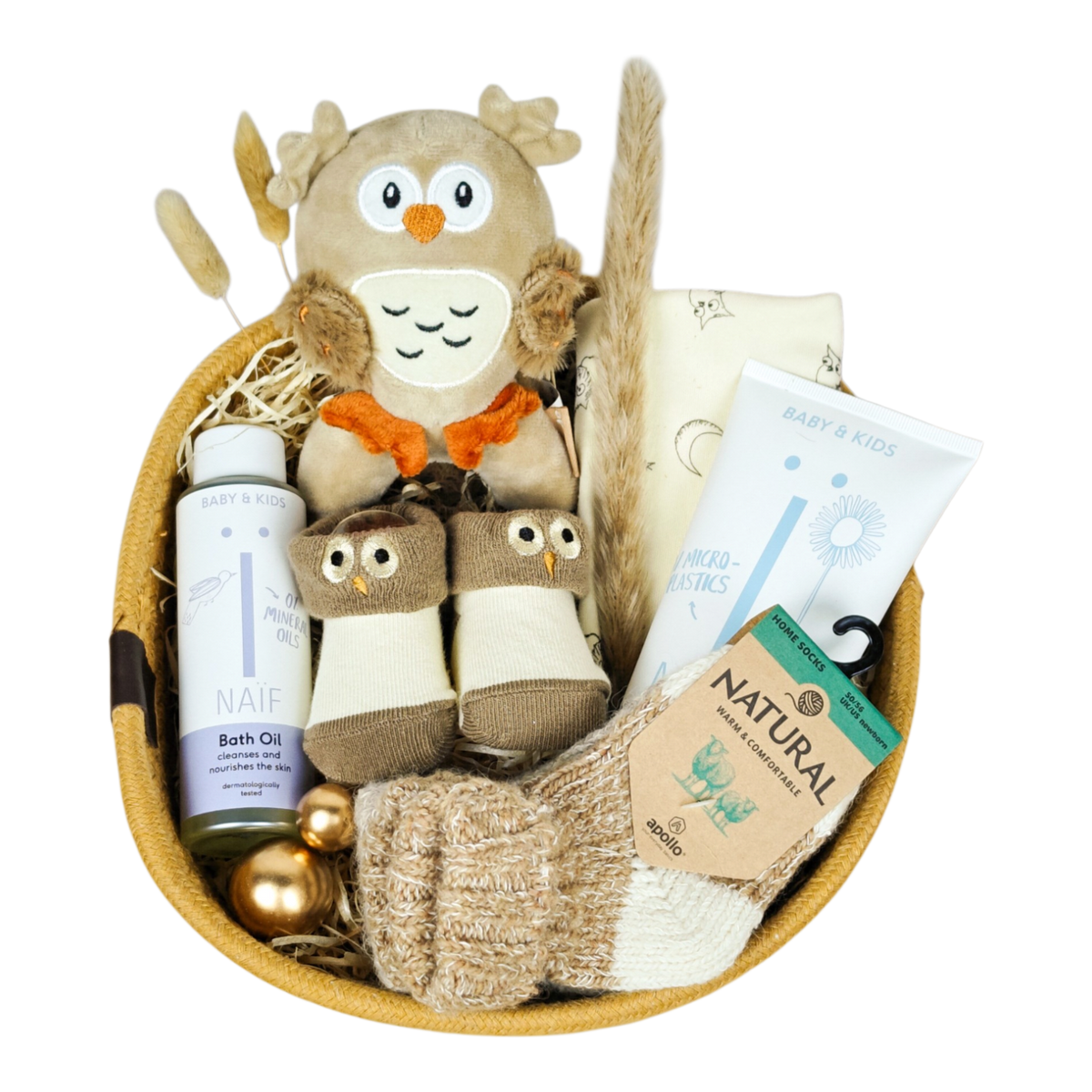 Owen baby gift basket with Apollo owl set, wool socks and NAÏF bath oil and washing gel in warm natural tones
