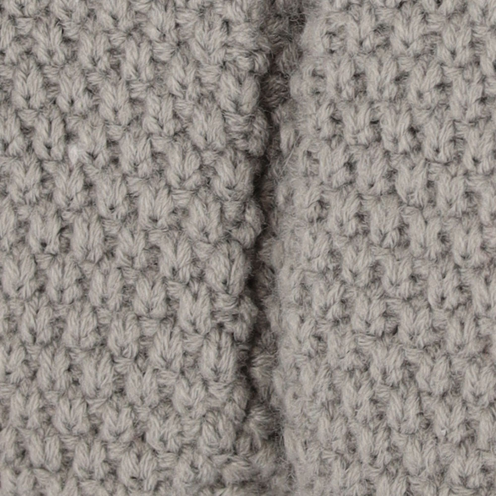Vue détaillée de la structure tricotée gris clair des chaussures bébé Apollo