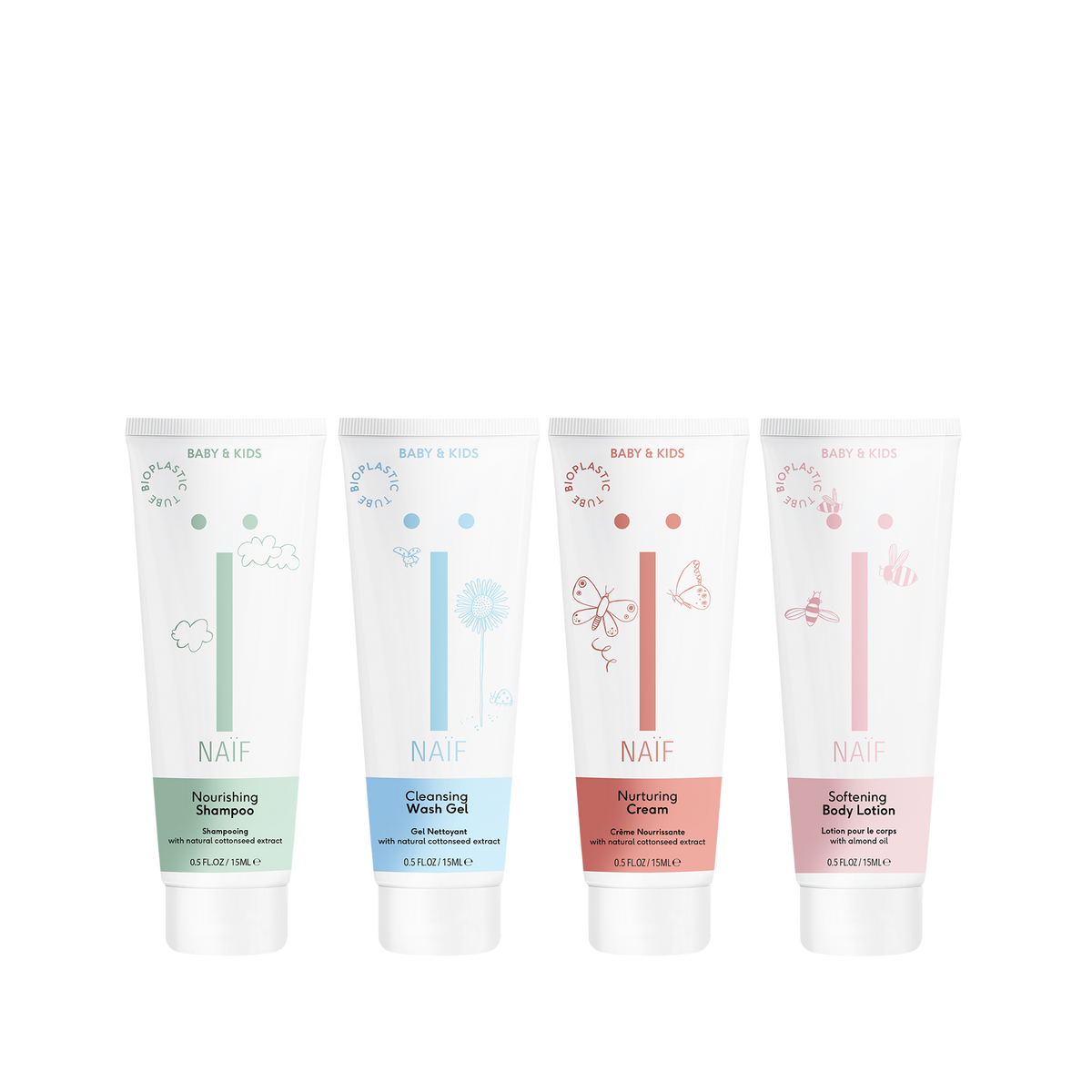 Quattro prodotti per la cura Naïf Baby & Kids in formato da viaggio: shampoo curativo, gel detergente, crema curativa e crema per pannolini.